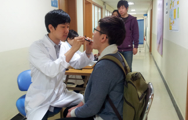 A student is taking a regular dental check-up at SNU Health Center