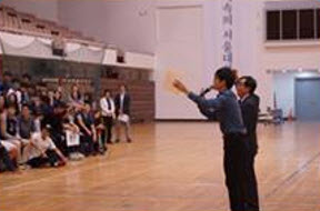 Rock-paper-scissor game with the Dean of the Students during the Opening Ceremony